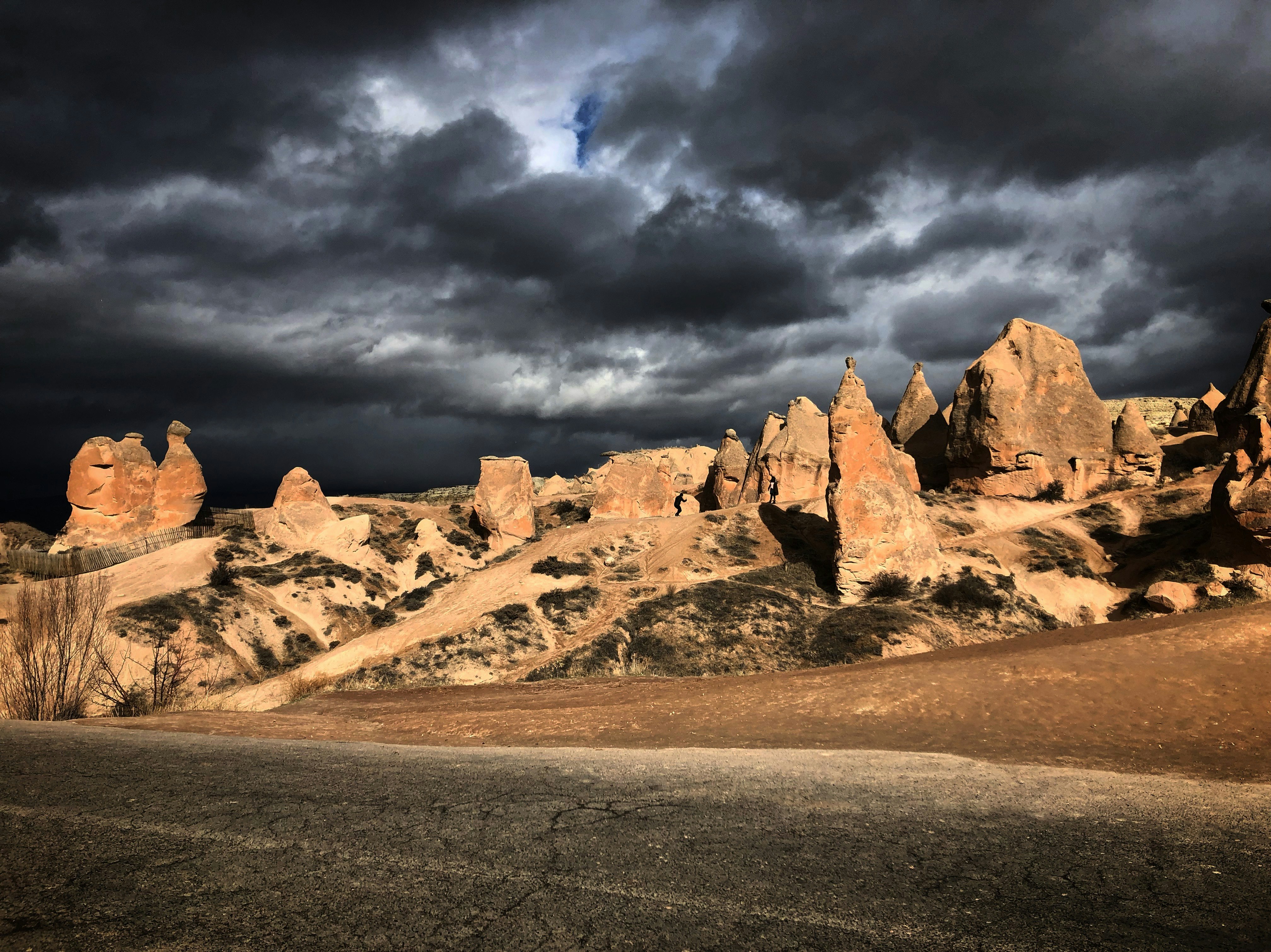 brown rock formation under cloudy sky during daytime